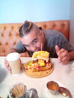 A happy customer enjoying a loaded Jules Kitchen meal
