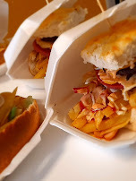 Mini Khulani Kotas — quarter-loaf sandwiches stuffed with chips and toppings